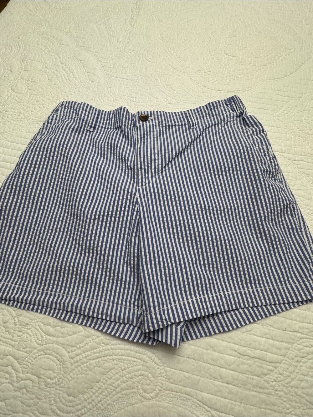 Old Navy, blue and white vertical striped seersucker shorts
Size large